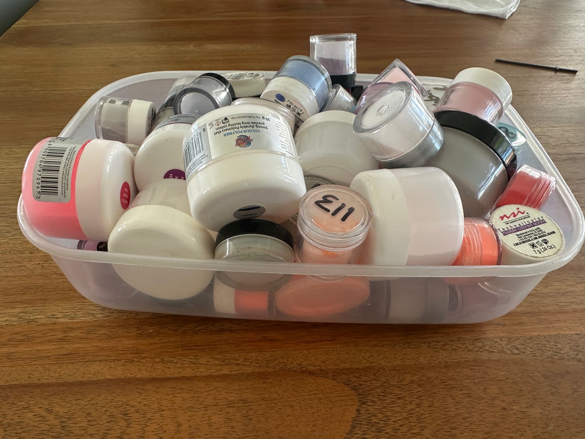 A bowl full of various acrylic powders